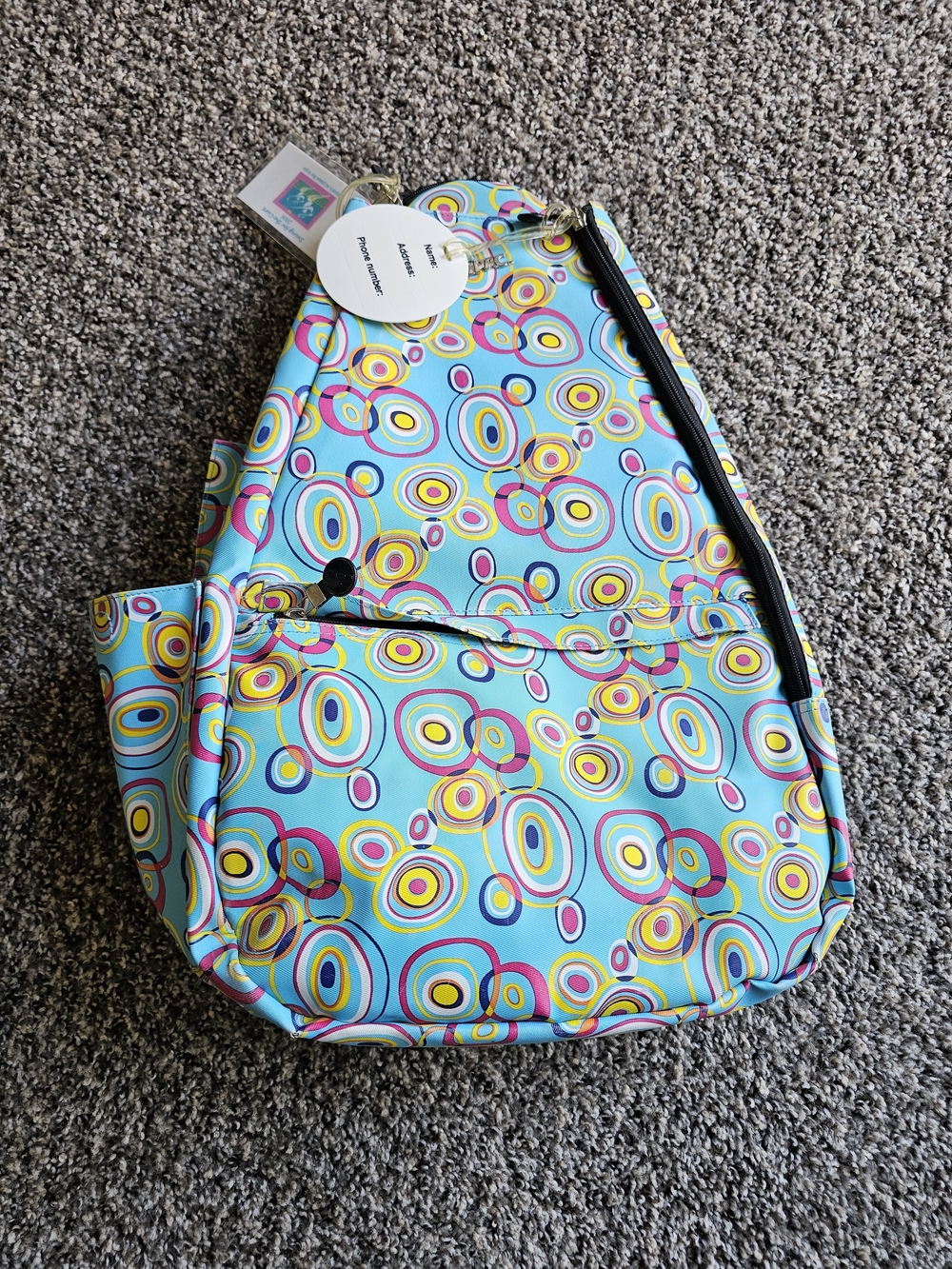 Jetpac Colorful Circle Print Sling Backpack - Turquoise, Yellow, Pink